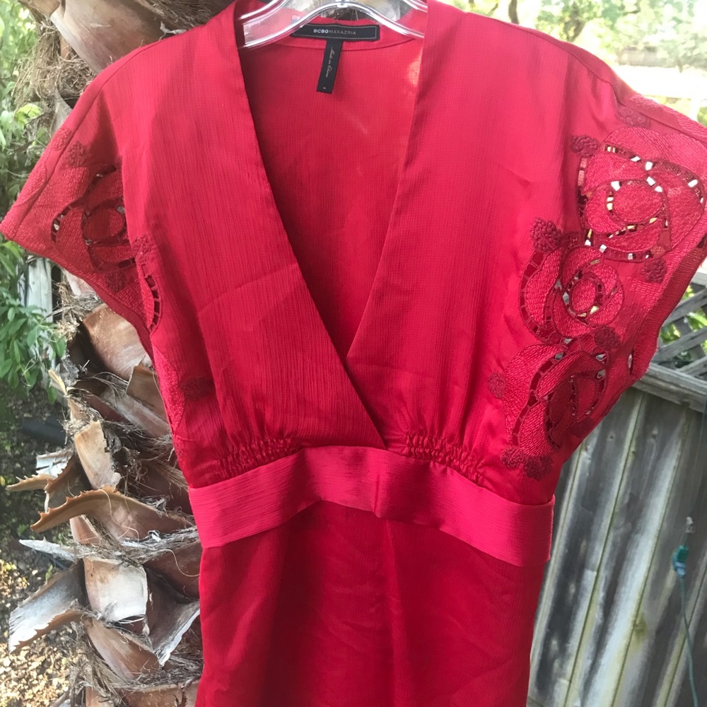 Size M. Elegant raspberry colored top